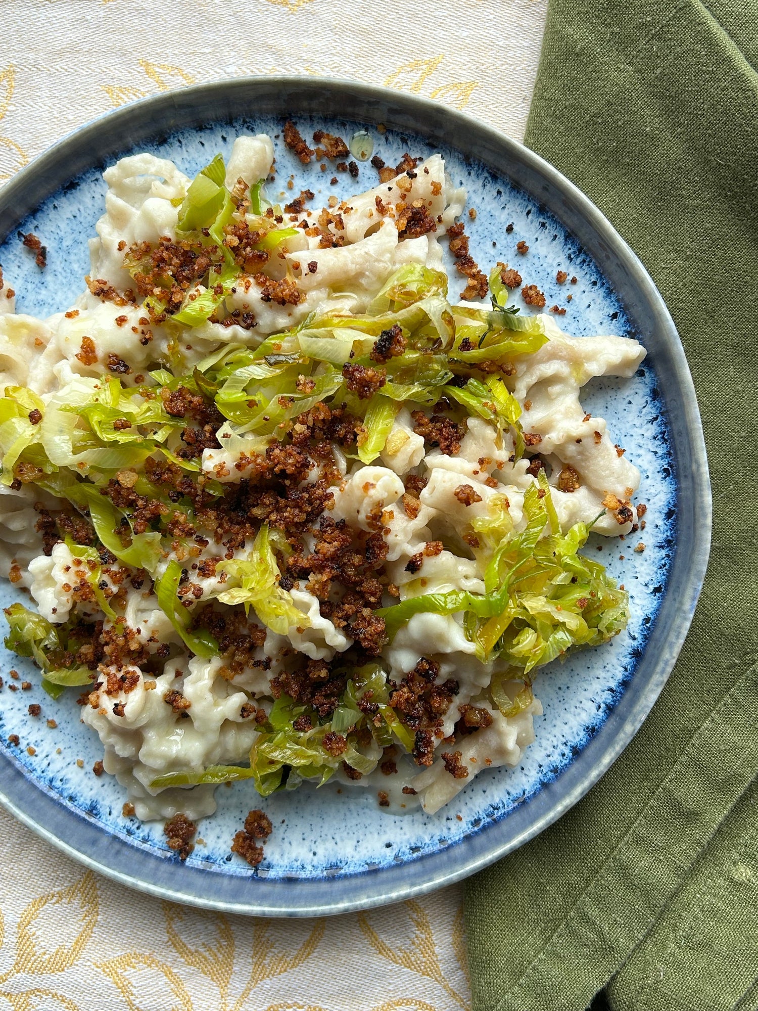 Creamy celeriac gigli, caramelised leeks, and marmite pangrattato